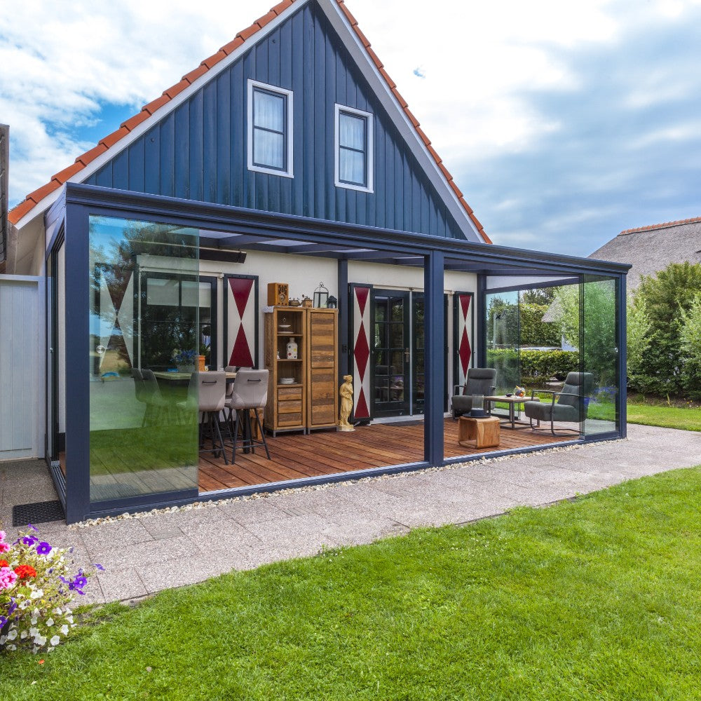 A wall-connected veranda creating a sheltered terrace beside a modern home