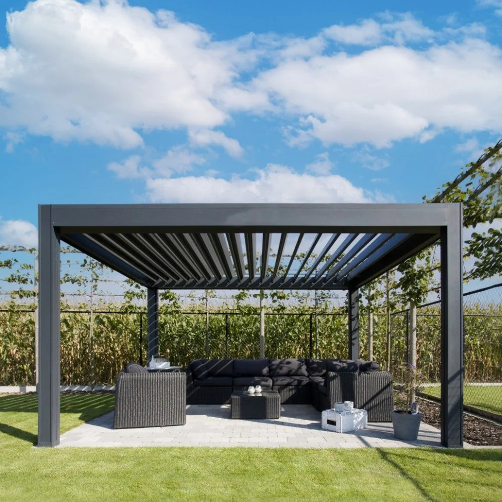Anthracite Remanso electric louvred pergola sheltering a dark outdoor sofa setting